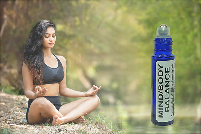 Meditating woman surrounded by nature, symbolizing calm and balance — Bee Well CBD Oil